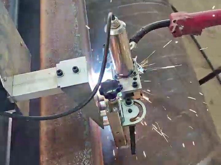Straight-track carriage welding with arc and sparks — shipyard panel seam
